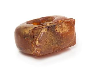 * A Carved Amber Archer's Ring, 9.50 dwts.