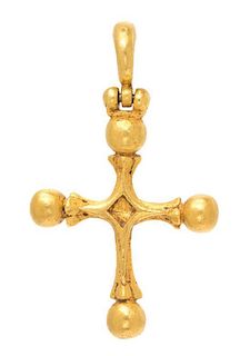 * A Sculpted Gold Cross Pendant, 16.90 dwts.