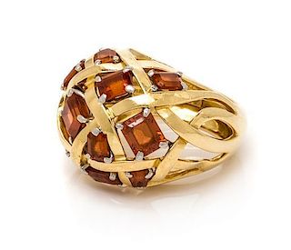 An 18 Karat Yellow Gold, Platinum and Garnet "Dome Of Ribbons" Ring, Schlumberger for Tiffany & Co., 9.90 dwts.