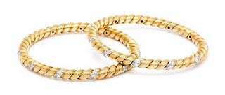 A Pair of 18 Karat Yellow Gold, Platinum and Diamond Bangle Bracelets, Van Cleef & Arpels, France, 40.90 dwts.