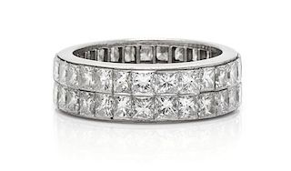 * A Platinum and Diamond Eternity Band, 5.60 dwts.