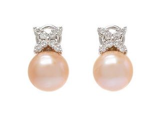 * A Pair of 18 Karat White Gold, Cultured Pearl and Diamond Earclips, 5.45 dwts.