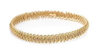 An 18 Karat Yellow Gold Bangle Bracelet, Tiffany & Co., France, 15.00 dwts.