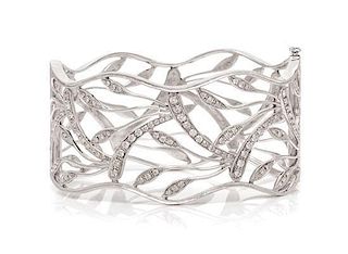 * A White Gold and Diamond Openwork Bangle Bracelet, 25.80 dwts.