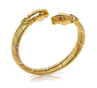 An 18 Karat Tri Color Gold Panthere Bypass Bracelet, Cartier, 31.40 dwts.