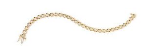 A 14 Karat Yellow Gold and Diamond Line Bracelet, 7.50 dwts.