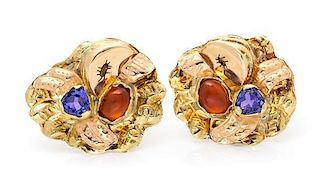 A Pair of 18 Karat Bicolor Gold, Tanzanite and Hessonite Earclips, Margaret Barnaby, 8.50 dwts.