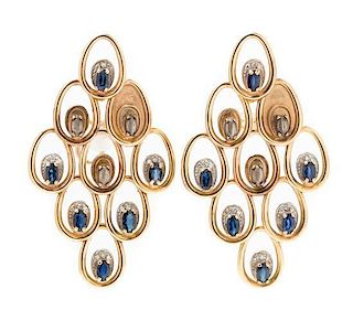 A Pair of Yellow Gold, Sterling Silver, and Sapphire "Dream Voyage" Earclips, Erte, 13.50 dwts.