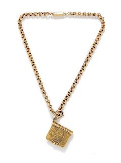 A Victorian Yellow Gold Book Motif Locket Pendant and Chain, 21.60 dwts.