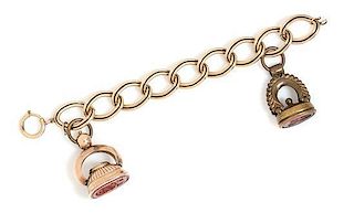 A Gold-Filled Bracelet with Two Attached Hardstone Intaglio Fobs, 51.30 dwts.