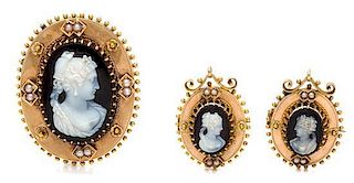 A Collection of Etruscan Revival Yellow Gold, Onyx and Seed Pearl Cameo Brooches, 18.20 dwts.