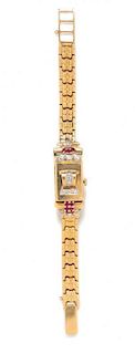 * A Retro 14 Karat Yellow Gold, Diamond and Ruby Surprise Wristwatch, Tempus, 19.50 dwts.