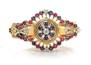 An 18 Karat Yellow Gold, Diamond, Sapphire and Ruby Surprise Wristwatch, 29.30 dwts.