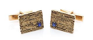 * A Pair of 14 Karat Yellow Gold and Synthetic Sapphire Cufflinks, 7.30 dwts.