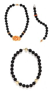 A Collection of 14 Karat Yellow Gold, Onyx, Coral and Diamond Bead Jewelry,