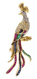 * An 18 Karat Yellow Gold, Ruby, Sapphire, Emerald and Diamond Articulated Peacock Brooch, 11.10 dwts.
