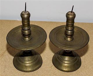 A Pair of Continental Brass Candlesticks Height 9 1/2 inches.