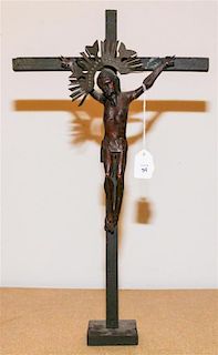A Carved and Painted Wood Crucifix Height 18 inches.