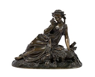 RECLINING BRONZE OF A NYMPH WITH SHELL