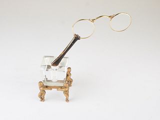 A Victorian pair of 15 carat yellow gold lorgnette spectacles made in France.