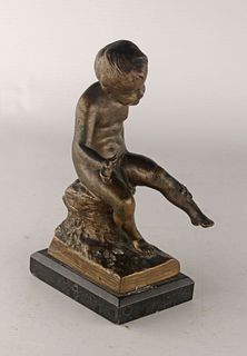 Bronze sculpture of a boy