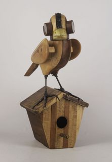Bird and his house, made of wood, leather and recycled metal by the artist David Klauser