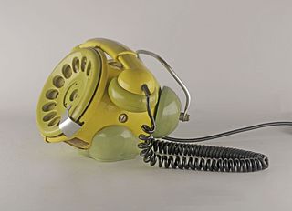 TELEPHONE a Disco BOBO Design by Sergio Todeschini for TELCER Telefonia MilanoFamous old telephone with unmistakable shapes, yellow in color and char