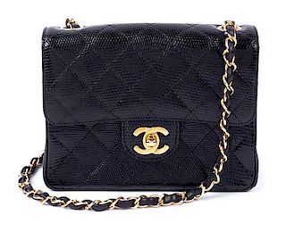 * A Chanel Black Lizard Flap Handbag, 6.5" x 5" x 2".