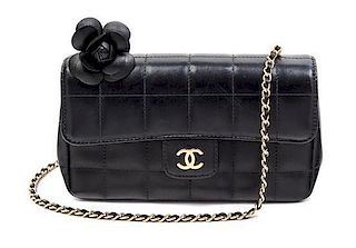 * A Chanel Black Quilted Mini Flap Handbag, 7.5" x 4" x 1.5"