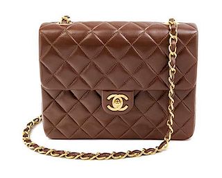 * A Chanel Brown Quilted Flap Handbag, 8" x 6" x 2.5".