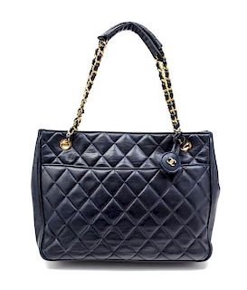 * A Chanel Navy Quilted Leather Tote Handbag, 12" x 8" x 2".