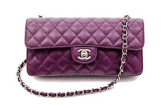 * A Chanel Plum Caviar Leather Single Flap Bag, 10" x 5" x 2".