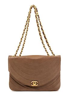 * A Chanel Taupe Quilted Flap Handbag, 9" x 6" x 2".