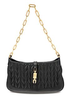 * A Gucci Black Quilted Handbag, 10" x 5.5" x 1.5".