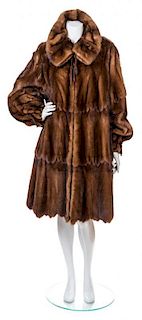 * A Fendi Brown Wild Mink Coat, Size 40.