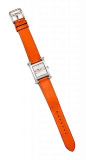 * An Hermes Stainless Steel Orange 'H' Watch, Face 1" square