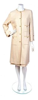 A Chanel Cream and Metallic Gold Skirt Suit, Jacket Size 42. Skirt Size 42.
