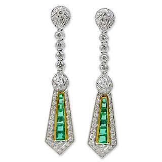 1.70 Carat Round Brilliant Cut Diamond. 1.41 Carat Emerald and 18 Karat Gold Pendant Earrings.