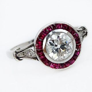 Art Deco Approx. .80 Carat European Cut Diamond, Caliber Cut Ruby and Platinum Engagement Ring.