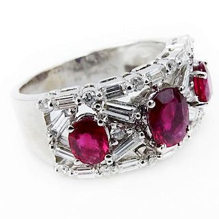 2.50 Carat Round Brilliant and Baguette Cut Diamond, Oval Cut Ruby and 18 Karat White Gold Ring.
