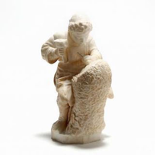 A Carved Alabaster Sculpture of a Sculptor