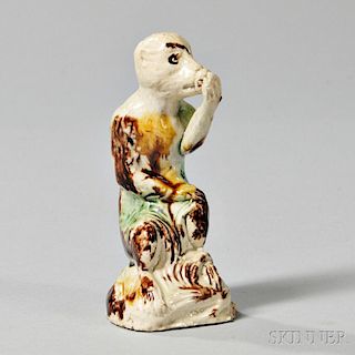 Cream-colored Earthenware Figure of a Monkey