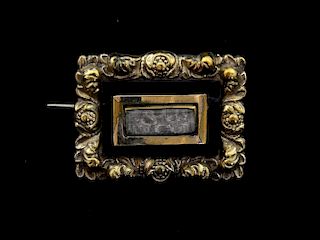 Victorian onyx and gold mourning brooch