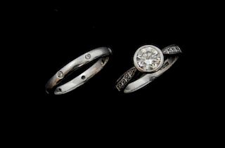 Diamond ring with collet set diamond of 0.80 carat and diamond set shoulders, in platinum mount and a platinum wedding band i