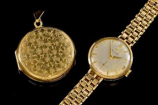 Gold cased locket with floral engraving,  a gold cyma watch on bracelet strap, 9 ct