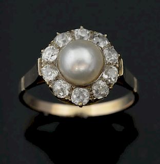 Diamond and pearl ring,  the central pearl within a border of  ten old cut diamonds, total diamond weight estimated at 1.00 c