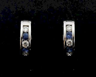 Sapphire and diamond hoop earrings, huggie style hoops set with alternating sapphire and diamond in channel setting mounted i
