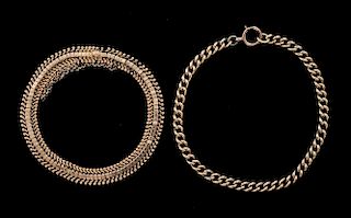Two gold bracelets, one curb link chain and another of articulated links