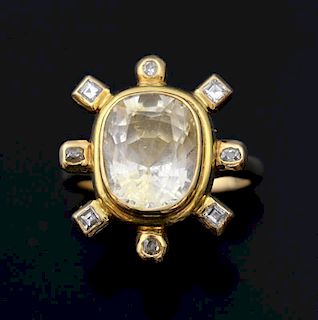 Yellow sapphire and diamond ring, oval cut sapphire to centre measuring 12 x 10 mm with eight diamonds to the surround. Mount