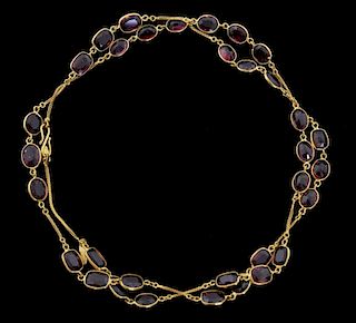 Gold necklace set with deep pink and red rhodolite garnets, 65 cm length